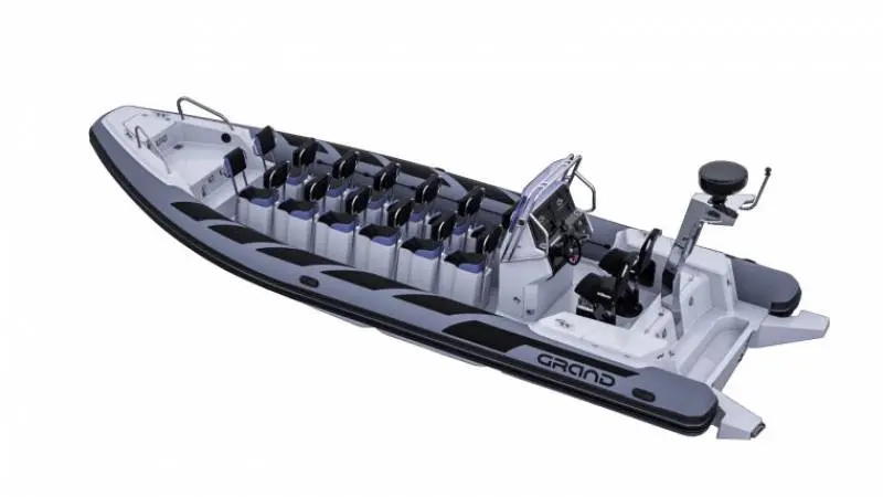 Grand Drive Line D950 — Bateau pneumatique gris et blanc vu en plongée, avec console centrale et sièges multiples.