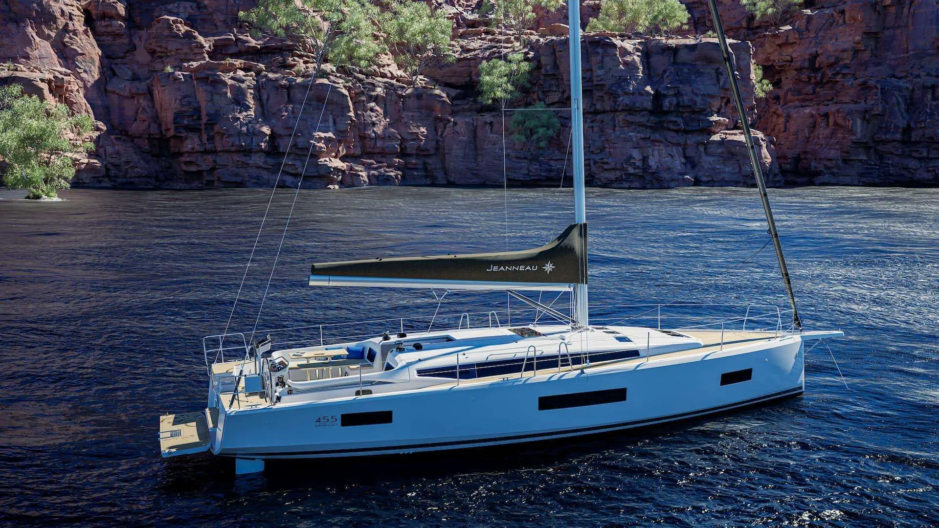 Jeanneau Sun Odyssey 455 — Voilier blanc vu de trois quarts sur une rivière bordée de falaises.